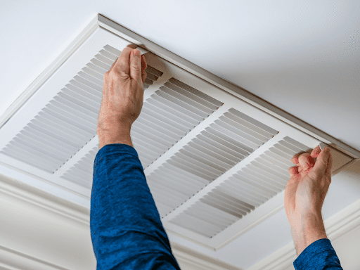 A man preparing to inspect air ducts in a McKinney, TX home.