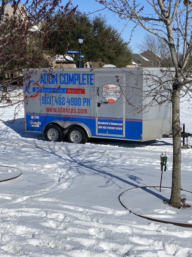 Adon truck parked in snow in front of McKinney, TX, home.